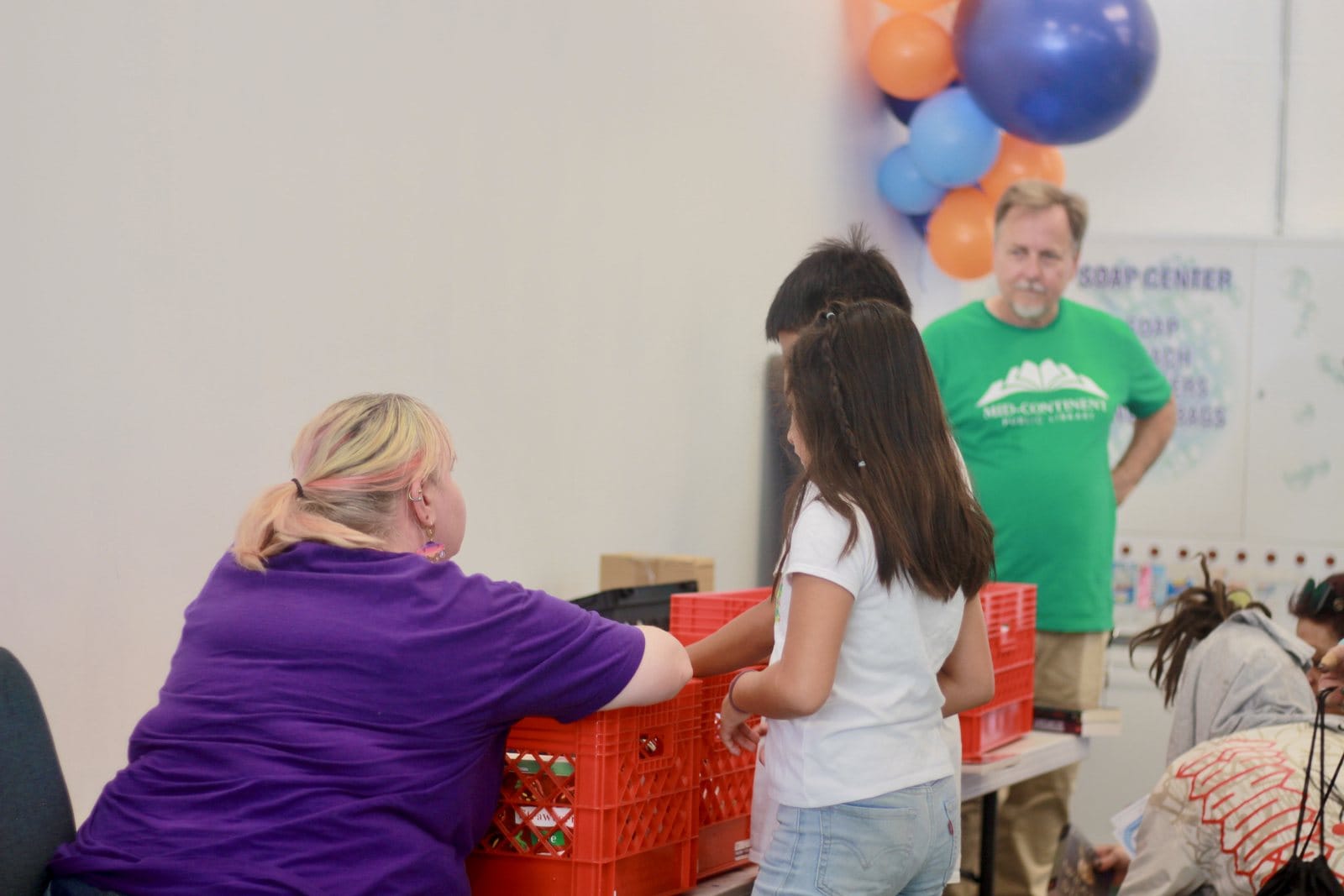 Fresh Spin Laundry team members and guests help families during Community Care Day in Independence, Missouri.